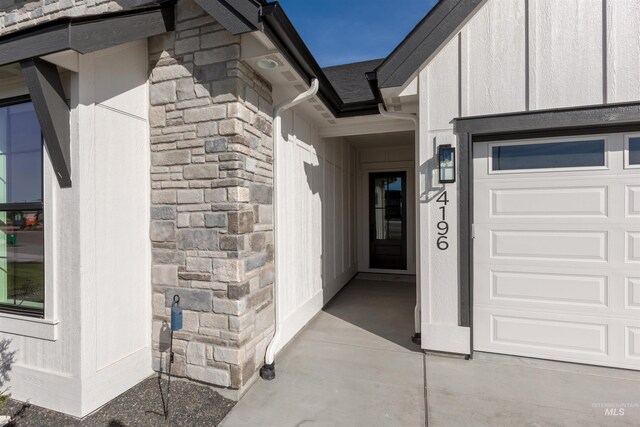 entrance to property featuring stone siding