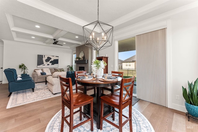 2255 N Sugar Loop Ave, Star, ID 83669 - dining room with light wood-type flooring, coffered ceiling, beamed ceiling, a chandelier, and a ceiling fan