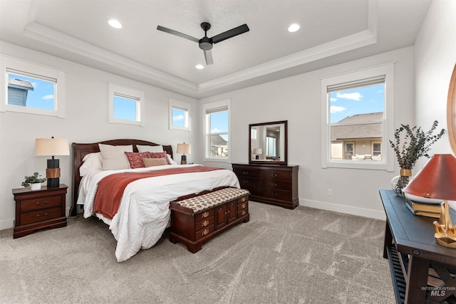 2255 N Sugar Loop Ave, Star, ID 83669 - bedroom with a tray ceiling, light colored carpet, ceiling fan, and recessed lighting
