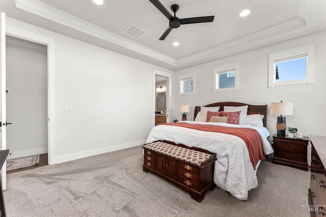 2255 N Sugar Loop Ave, Star, ID 83669 - bedroom featuring a tray ceiling, light colored carpet, recessed lighting, ensuite bathroom, and ceiling fan