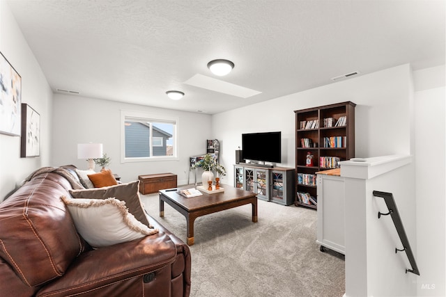 2255 N Sugar Loop Ave, Star, ID 83669 - living area with light colored carpet, a skylight, and a textured ceiling