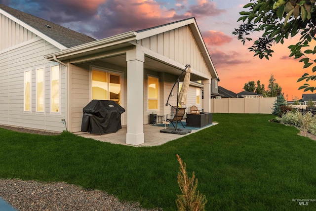 2255 N Sugar Loop Ave, Star, ID 83669 - back of house featuring board and batten siding, a patio area, and a shingled roof