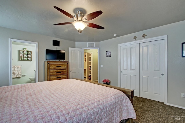 bedroom featuring a closet, visible vents, dark carpet, ceiling fan, and baseboards