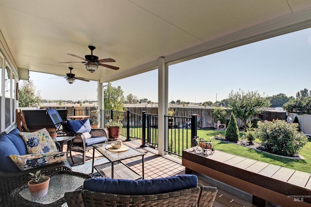 view of patio / terrace with outdoor lounge area, a fenced backyard, and a ceiling fan