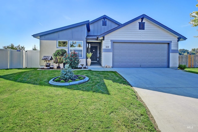 view of front of home featuring a front yard, concrete driveway, and fence