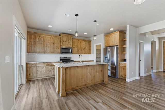 2065 Sombrero Ave, Middleton, ID 83644 - kitchen with stainless steel appliances, wood finished floors, recessed lighting, backsplash, and open shelves