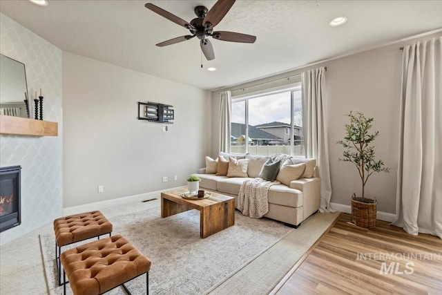 2065 Sombrero Ave, Middleton, ID 83644 - living room with ceiling fan, recessed lighting, light wood-type flooring, and a fireplace