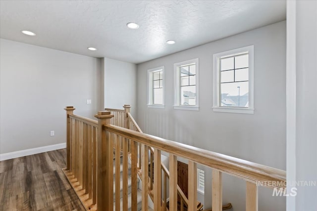 2065 Sombrero Ave, Middleton, ID 83644 - corridor featuring an upstairs landing, dark wood finished floors, and recessed lighting