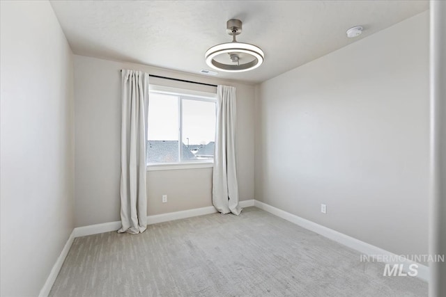 2065 Sombrero Ave, Middleton, ID 83644 - carpeted empty room with baseboards and a smoke detector
