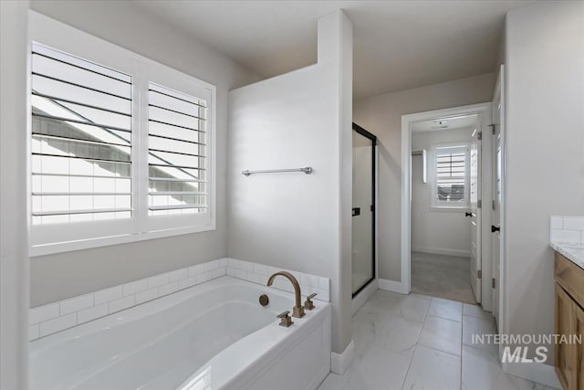 2065 Sombrero Ave, Middleton, ID 83644 - full bath with vanity, marble finish flooring, a bath, and a shower stall