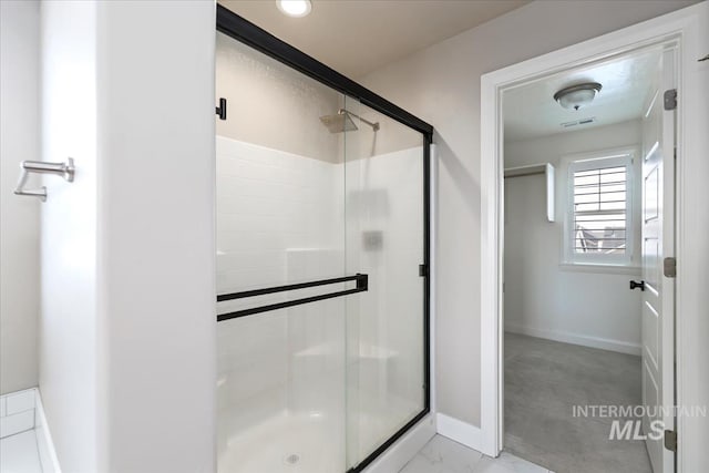 2065 Sombrero Ave, Middleton, ID 83644 - bathroom featuring a shower stall and marble finish flooring