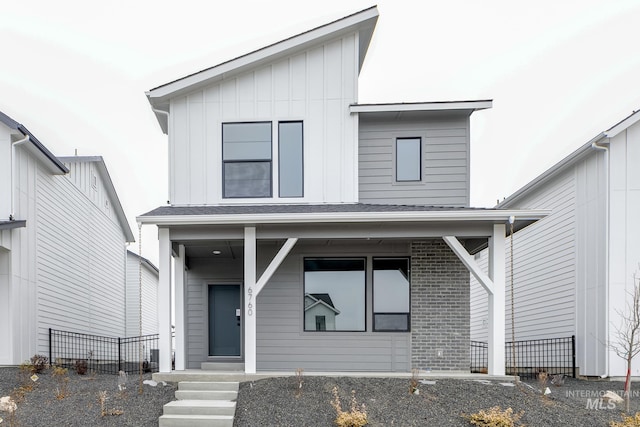 6760 S Cheyenne Ave, Boise, ID 83709 - view of front facade featuring covered porch, board and batten siding, and a shingled roof