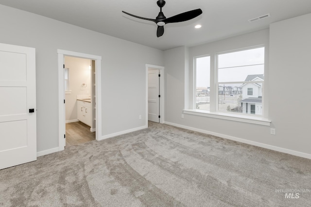 6760 S Cheyenne Ave, Boise, ID 83709 - unfurnished bedroom with visible vents, baseboards, carpet, ensuite bath, and a walk in closet