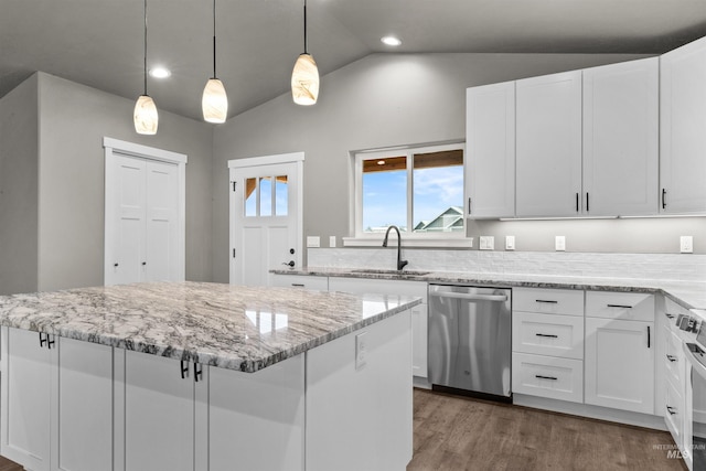 kitchen featuring light stone countertops, white cabinets, vaulted ceiling, sink, and dishwasher