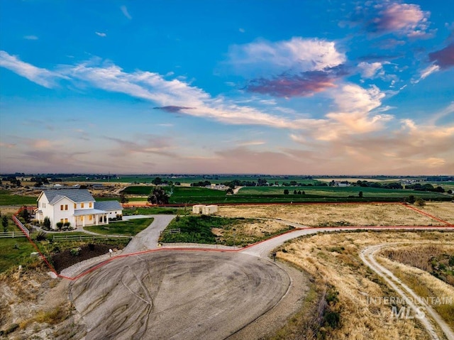 birds eye view of property featuring a rural view