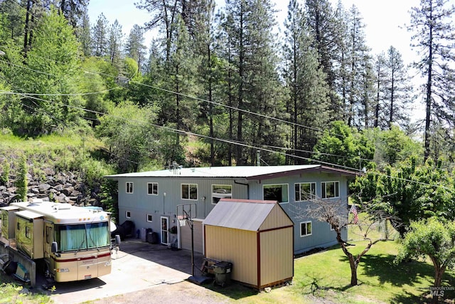34 Locust Dr, Orofino, ID 83544 - view of front of house with a front yard and a wooded view
