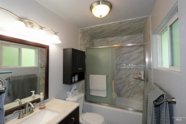 34 Locust Dr, Orofino, ID 83544 - bathroom featuring plenty of natural light, vanity, enclosed tub / shower combo, and toilet