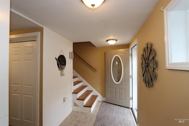 34 Locust Dr, Orofino, ID 83544 - entryway with stairway, light tile patterned floors, and baseboards