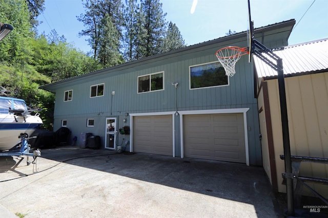 34 Locust Dr, Orofino, ID 83544 - back of house with an attached garage and driveway