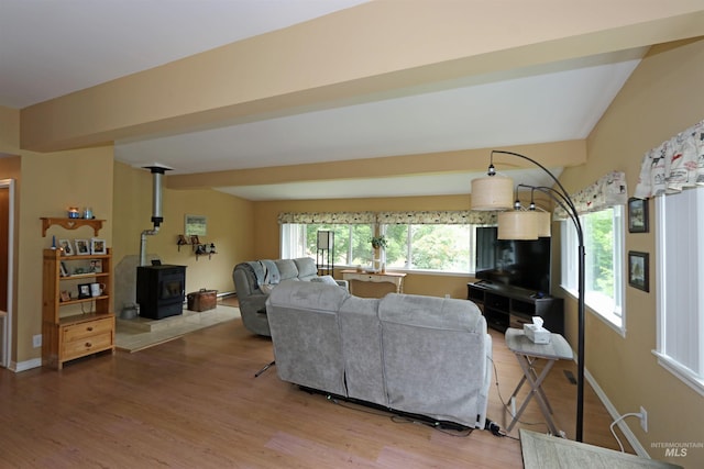 34 Locust Dr, Orofino, ID 83544 - living area with a wood stove, wood finished floors, and baseboards