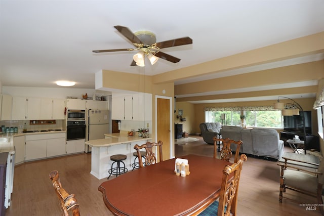 34 Locust Dr, Orofino, ID 83544 - dining area featuring a ceiling fan and light wood-style flooring