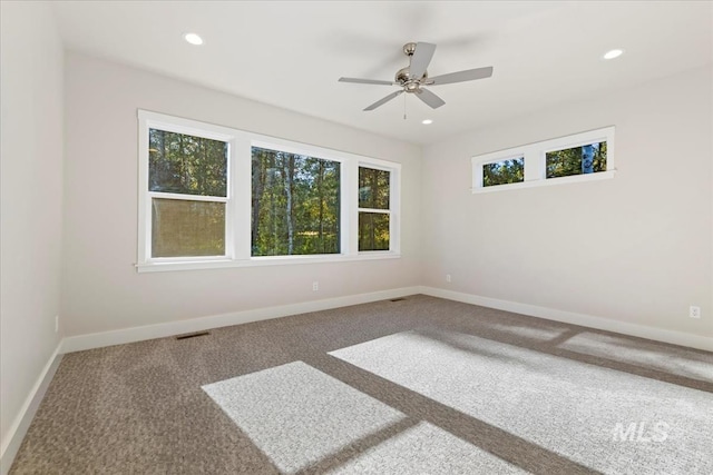 unfurnished room featuring carpet floors and ceiling fan