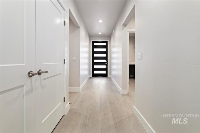 hallway featuring light hardwood / wood-style floors