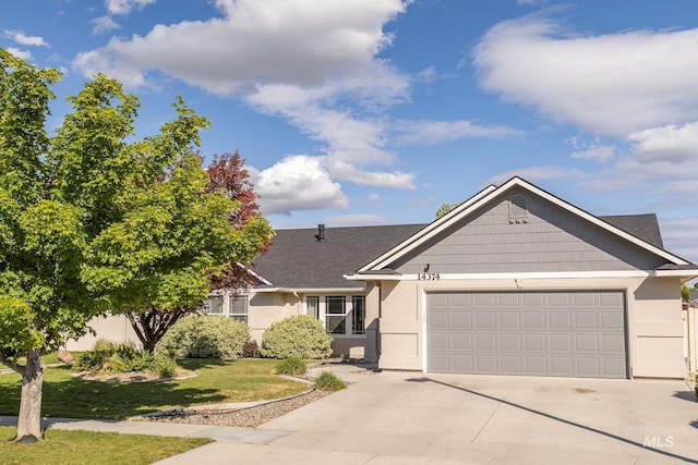 14374 N Acapulco, Nampa, ID 83651 - ranch-style home with concrete driveway, an attached garage, a front yard, stucco siding, and roof with shingles
