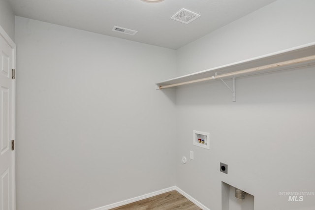 2089 N Thunderbolt St, Mountain Home, ID 83647 - washroom featuring washer hookup, electric dryer hookup, and light wood-style floors