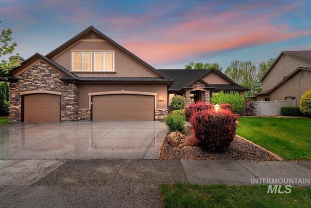 3731 S Firenze Way, Meridian, ID 83642 - view of front of home with stucco siding, stone siding, driveway, and a garage
