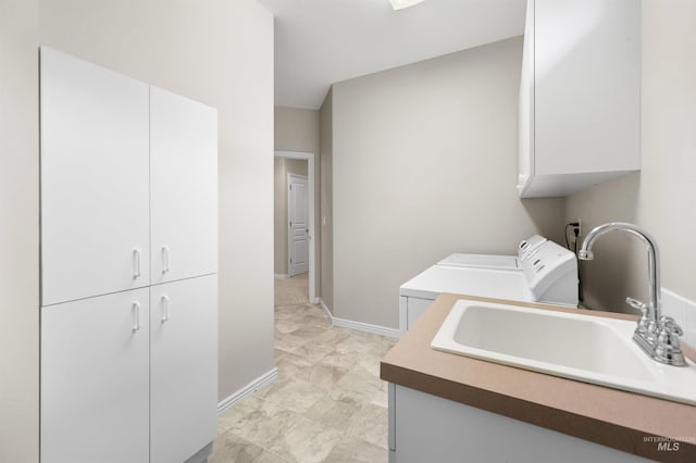 380 S Golden Eagle Ln, Eagle, ID 83616 - laundry room featuring cabinet space and light marble finish flooring