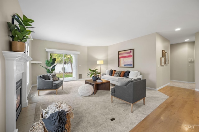 380 S Golden Eagle Ln, Eagle, ID 83616 - living room with light wood-style flooring, a glass covered fireplace, and recessed lighting