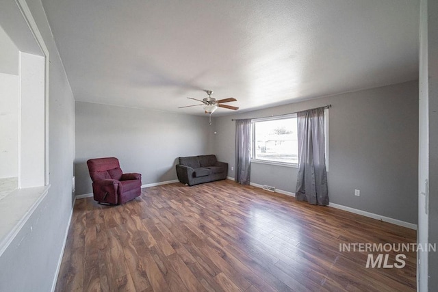 unfurnished room with dark hardwood / wood-style flooring and ceiling fan