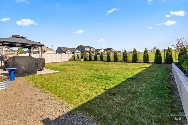 view of yard featuring a gazebo and a patio area