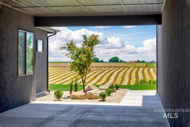 view of yard with a rural view