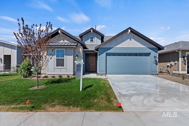 view of front of house with a garage and a front lawn