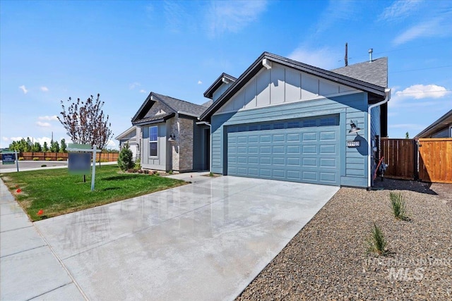 view of front of house with a garage and a front yard