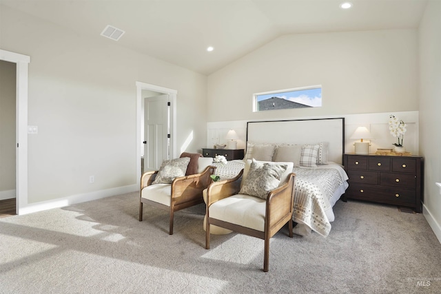 carpeted bedroom with vaulted ceiling