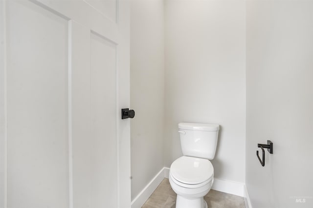 bathroom featuring tile patterned flooring and toilet