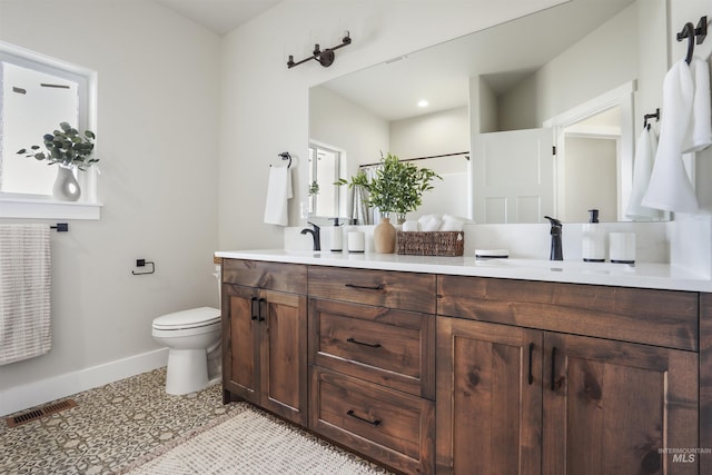 bathroom with vanity and toilet