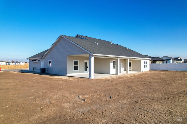 back of house featuring a patio area and central air condition unit