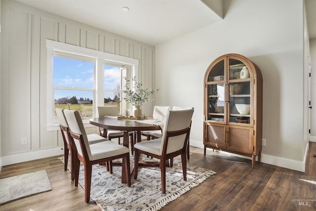 dining room with dark hardwood / wood-style floors