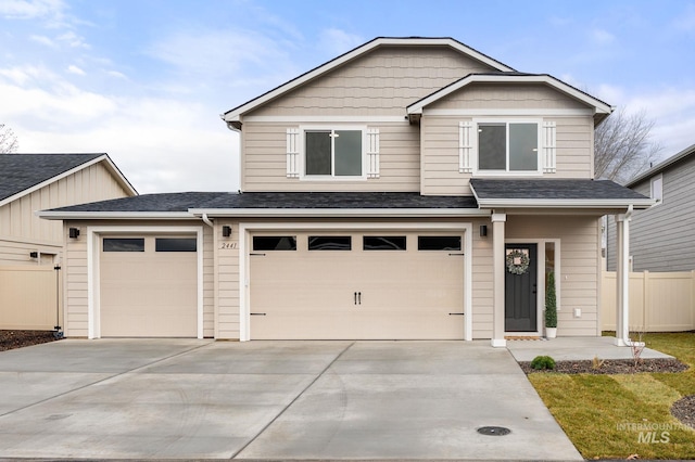 view of front of property with a garage