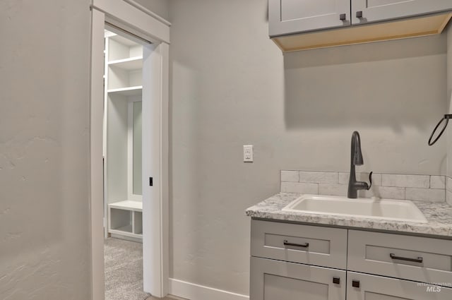 bathroom featuring vanity and baseboards