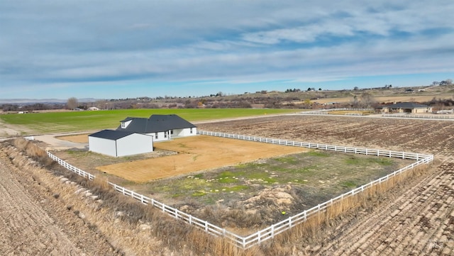 birds eye view of property with a rural view