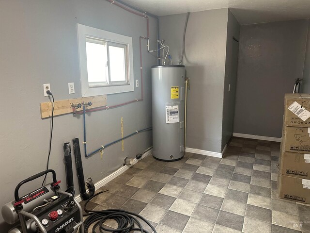 utility room featuring water heater