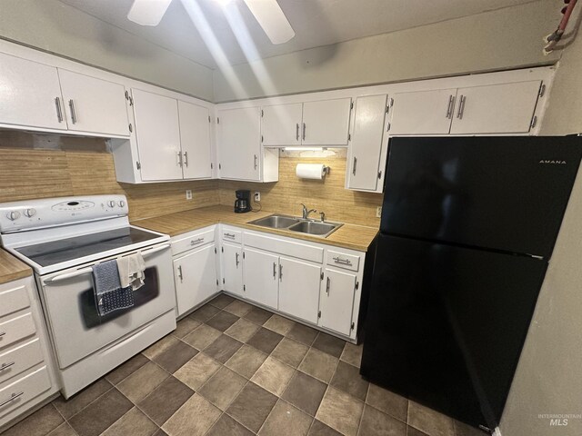 kitchen featuring tasteful backsplash, ceiling fan, white electric range, black fridge, and sink