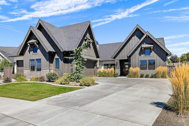 view of front facade with a garage and a front lawn