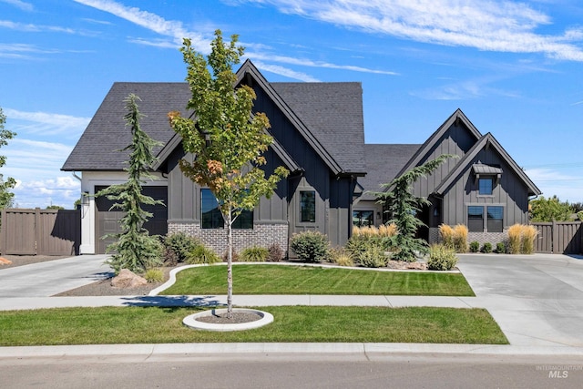 view of front facade with a front lawn and a garage