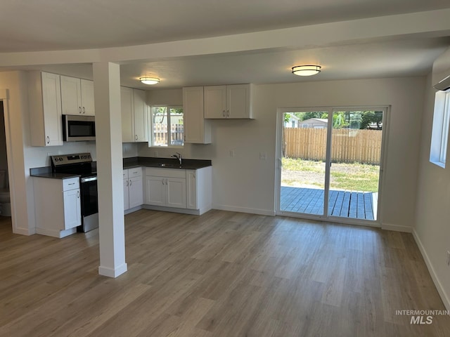 10331 W Utahna, Boise, ID 83714 - kitchen with appliances with stainless steel finishes, dark countertops, and baseboards